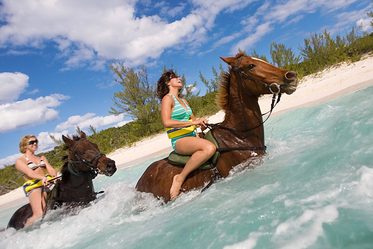 Among the dozens of island activities to choose from on Half Moon Cay, horseback riding excursions cover land and sea—and finish with a bareback swim in the bay. Watersports enthusiasts can rent snorkel gear, kayaks, and Hobie cats, or take a ride on a parasail or a windsurfer sailboard. 